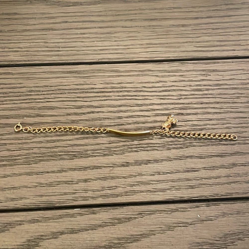 Child’s gold “Meghan” charm bracelet